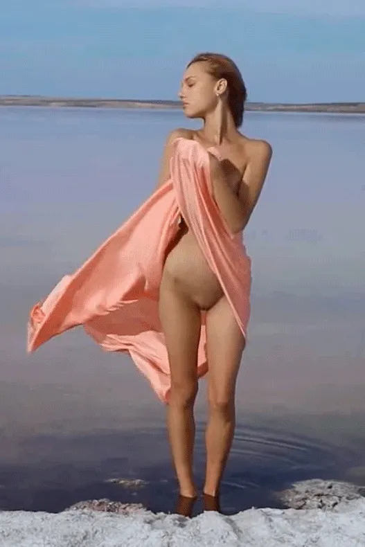 Nude teen on a beach